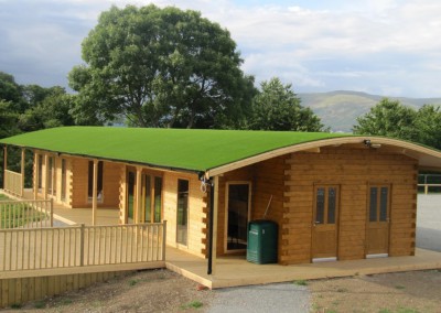 Roof covered in artificial grass at Beaver Log Cabins, Carlingford.