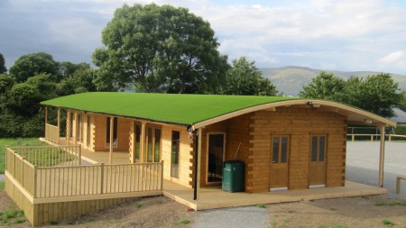 Roof covered in artificial grass at Beaver Log Cabins, Carlingford.